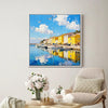 white frame wall art canvas painting depicts a bright harbor scene in a seaside town