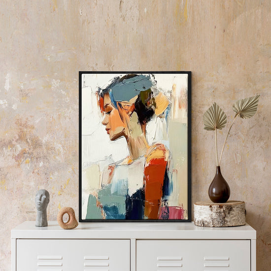 black frame wall art painting in the living room on the table