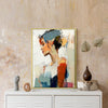 gold frame wall art women painting on the table