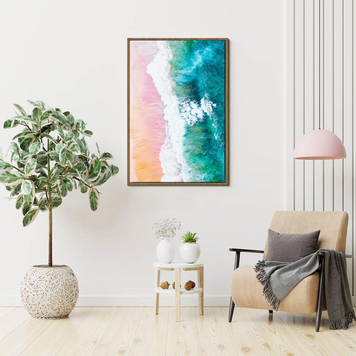 light oak color frame wall art canvas depicts pink sand beach and white waves