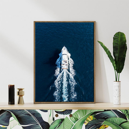 light oak color frame wall art canvas depicts a white yacht sails on the deep blue sea