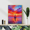 gold frame wall art painting depicts the beautiful scenery of a sailboat sailing on the sea dyed by the gorgeous sunset.